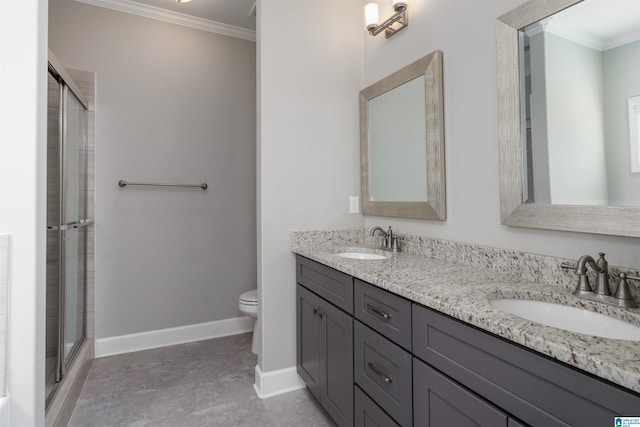 bathroom featuring vanity, toilet, a shower with shower door, and crown molding