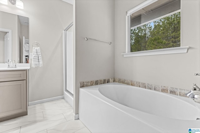 bathroom featuring independent shower and bath and vanity