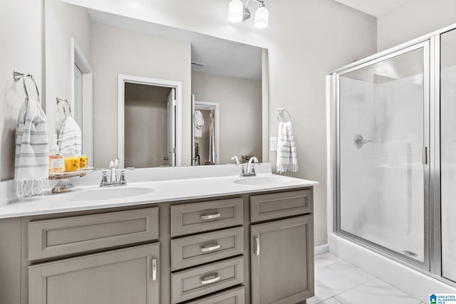 bathroom with walk in shower and vanity