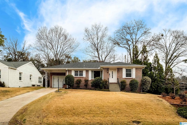 view of front of home with a front lawn and a garage