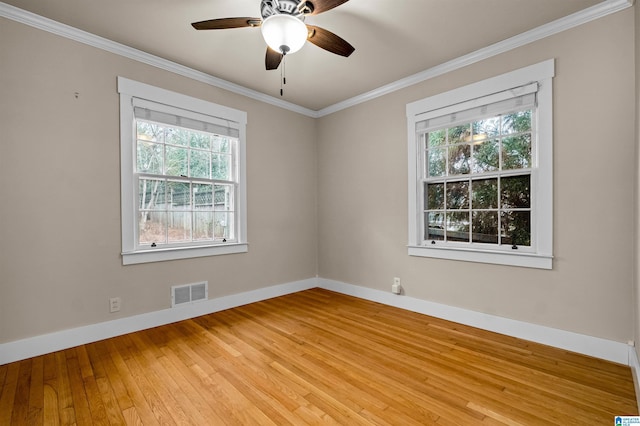 empty room with ceiling fan, light hardwood / wood-style flooring, and crown molding