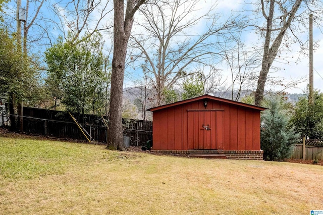 view of outbuilding featuring a lawn