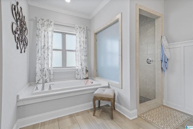 bathroom featuring shower with separate bathtub and crown molding