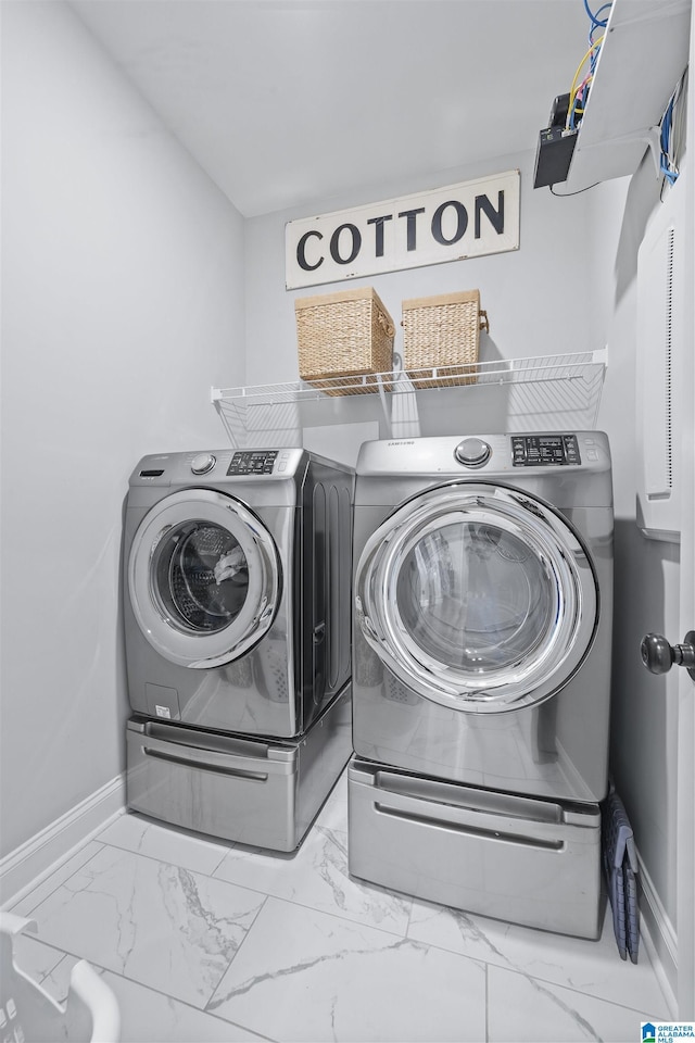 laundry area with separate washer and dryer