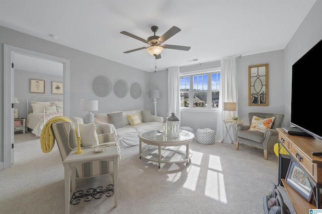 living room featuring ceiling fan and light carpet