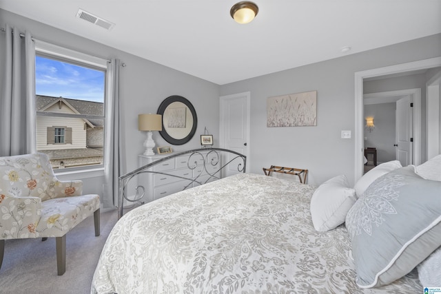 bedroom featuring light carpet