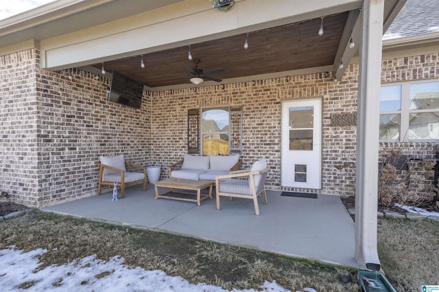 view of patio featuring ceiling fan