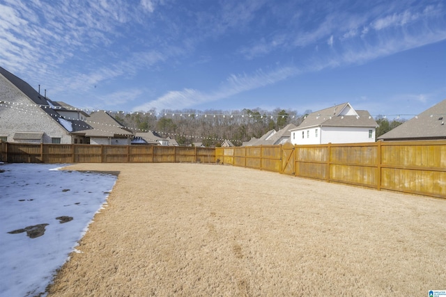 view of yard covered in snow