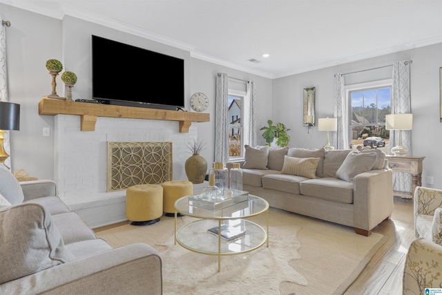 living room featuring light wood-type flooring and crown molding