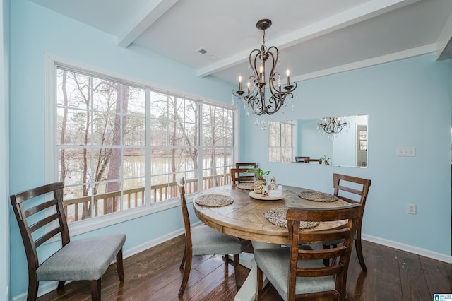 dining area with an inviting chandelier, beamed ceiling, and dark wood-type flooring