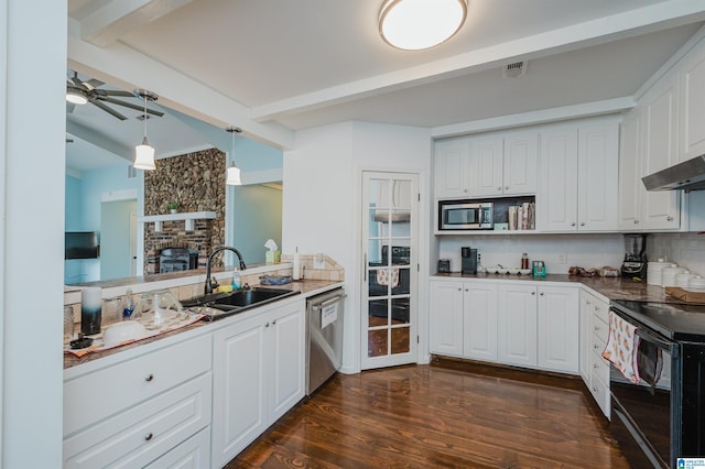 kitchen with stainless steel appliances, white cabinetry, hanging light fixtures, and sink