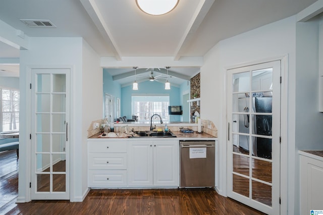 kitchen with dishwasher, white cabinets, lofted ceiling with beams, dark hardwood / wood-style flooring, and sink