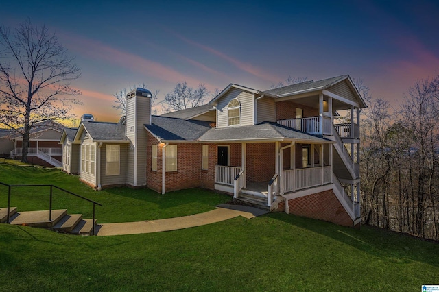 view of front of home with a lawn and covered porch