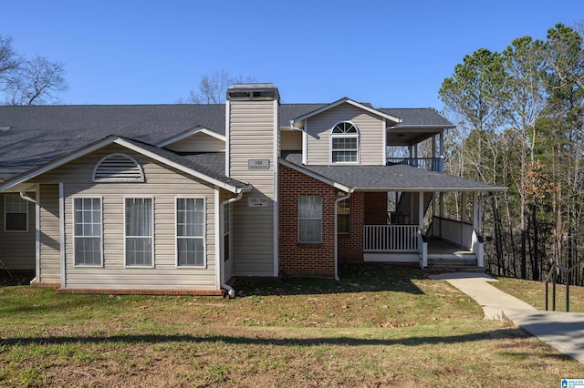 view of front of house featuring a porch and a front lawn