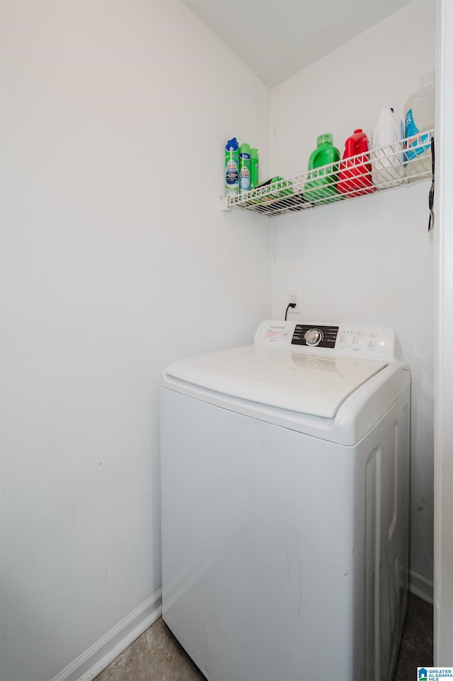 clothes washing area with washer / clothes dryer