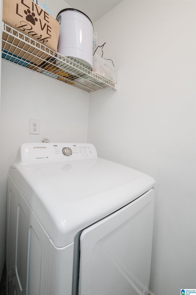 clothes washing area featuring washing machine and clothes dryer