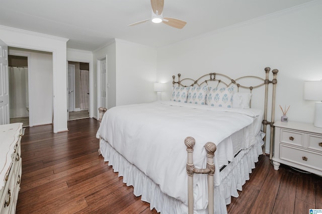 bedroom featuring ornamental molding, ceiling fan, and dark wood-type flooring