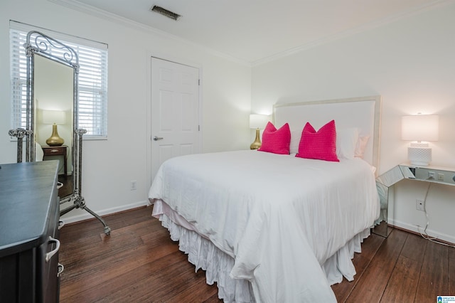 bedroom featuring dark hardwood / wood-style floors and ornamental molding