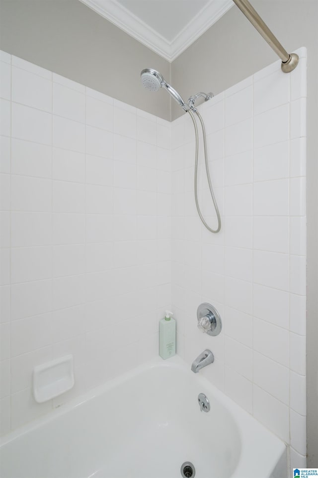 bathroom featuring shower / bathtub combination and ornamental molding