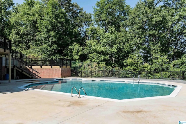 view of swimming pool with a patio area