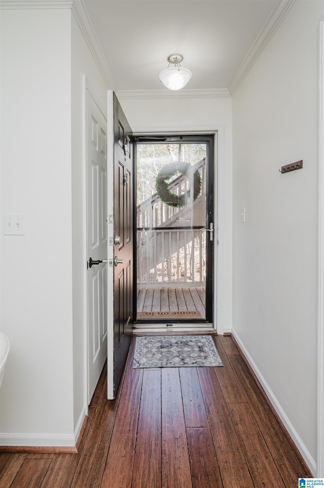 doorway with dark hardwood / wood-style flooring and crown molding