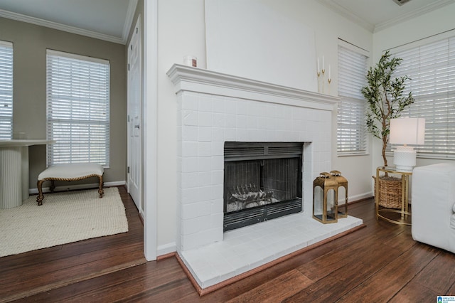 room details with hardwood / wood-style flooring, ornamental molding, and a brick fireplace