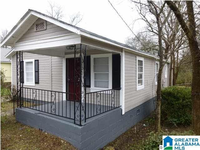 view of side of property featuring a porch