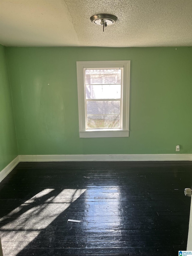 empty room with a textured ceiling