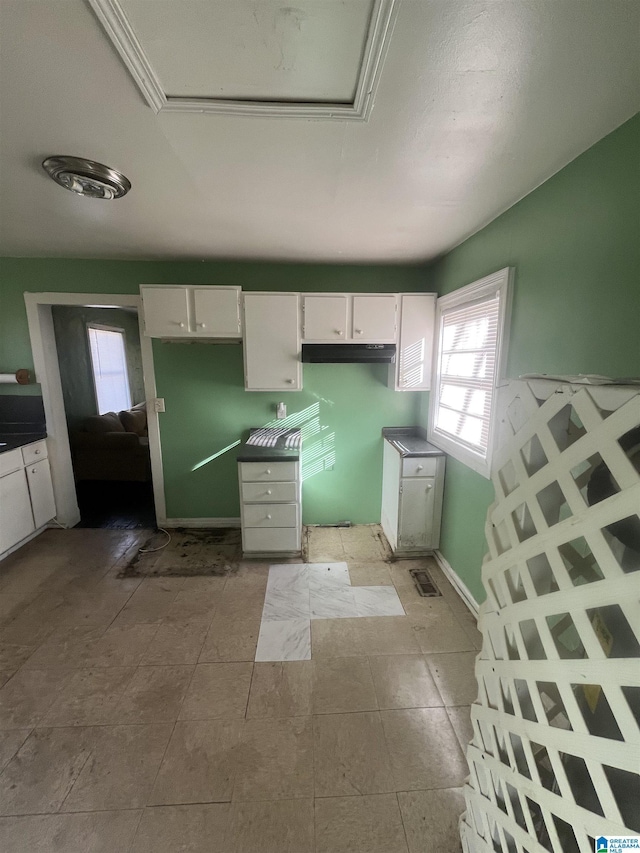 kitchen featuring white cabinets