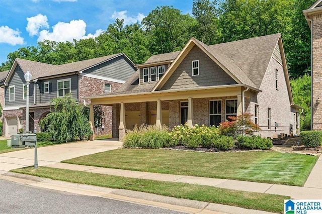 craftsman inspired home with a front yard