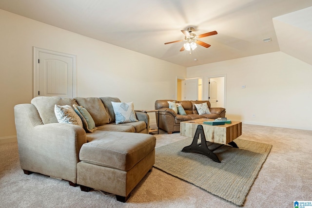 carpeted living room with ceiling fan