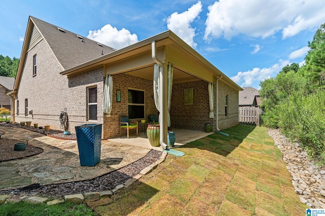 rear view of house featuring a patio