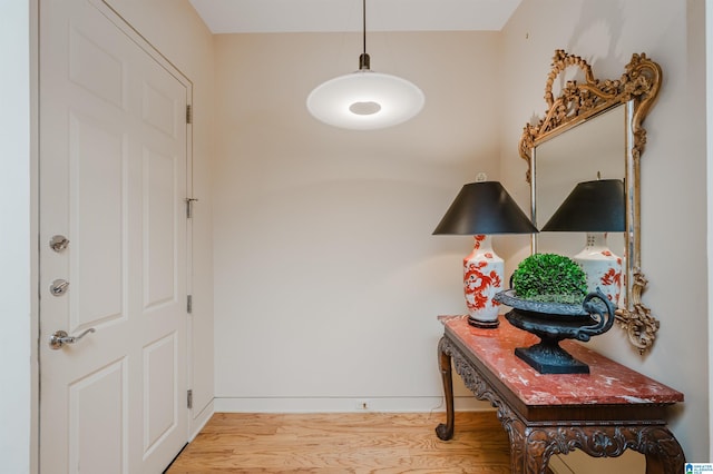 doorway with light hardwood / wood-style floors