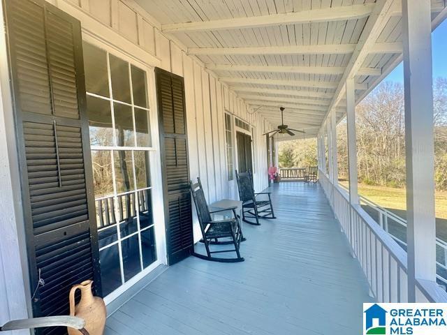 exterior space with covered porch and ceiling fan