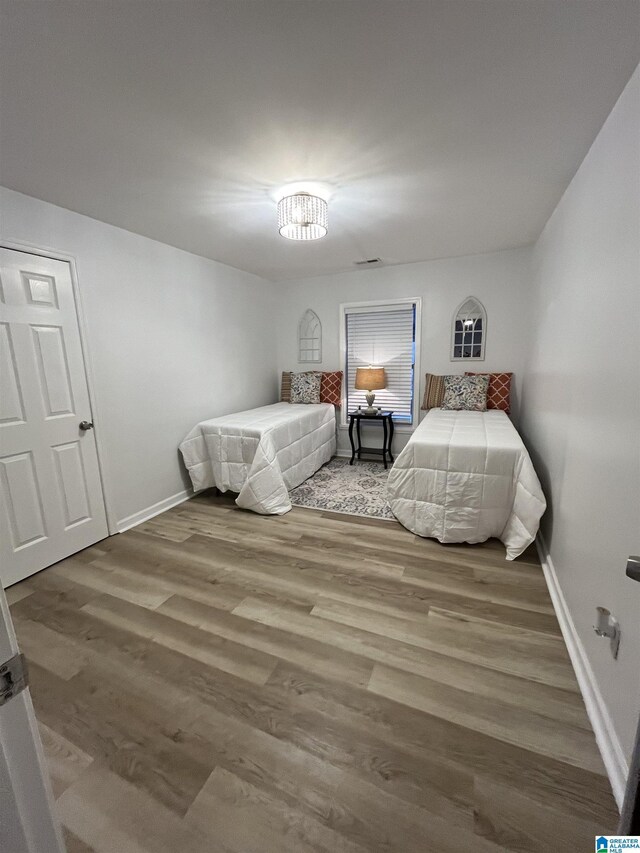 bedroom with light wood-type flooring