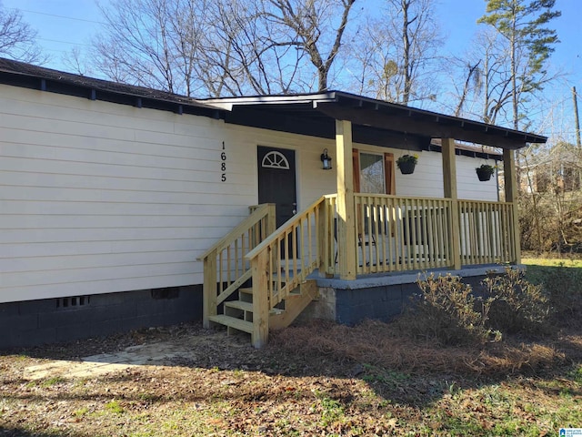 property entrance featuring covered porch