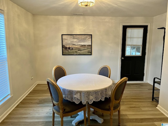 dining room with hardwood / wood-style floors