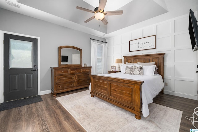 bedroom featuring ceiling fan and dark hardwood / wood-style flooring