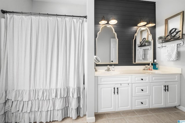 bathroom with tile patterned floors and vanity