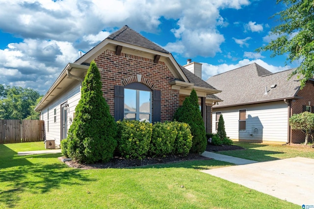 view of home's exterior featuring a yard and a patio