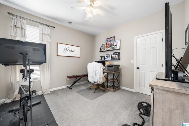 office space with carpet and ceiling fan