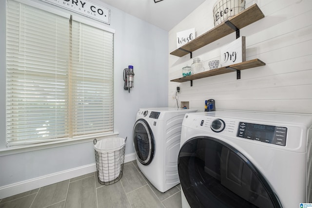 clothes washing area featuring washer and dryer