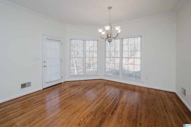 unfurnished dining area with ornamental molding, dark hardwood / wood-style flooring, and a notable chandelier