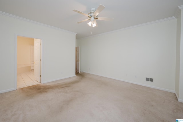 unfurnished room featuring light carpet, ceiling fan, and ornamental molding