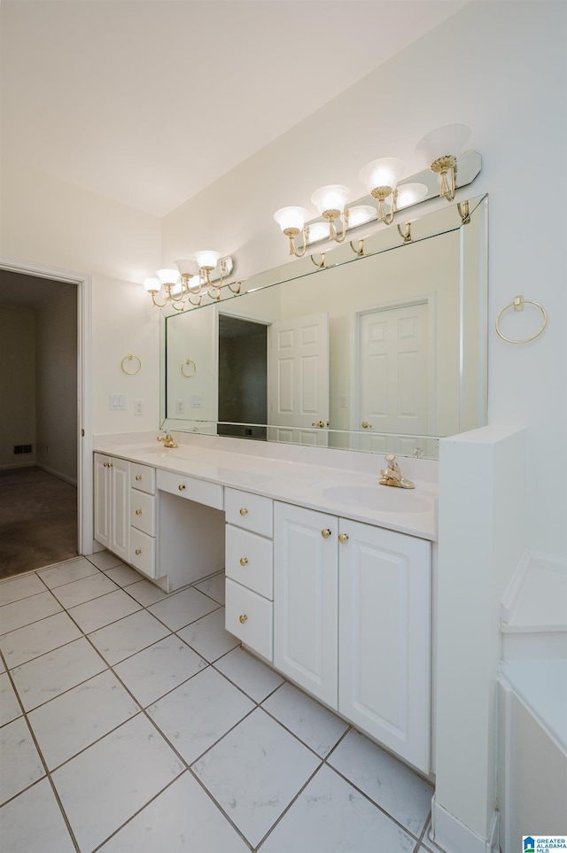 bathroom with tile patterned flooring and vanity