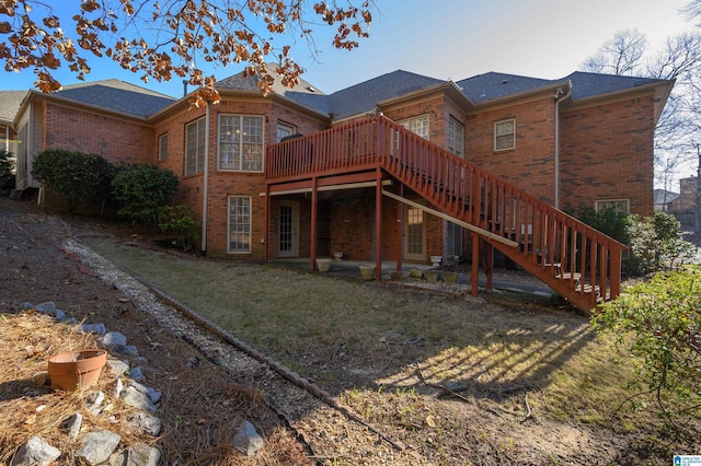 back of house with a wooden deck