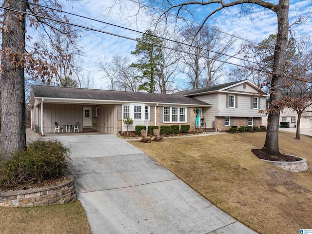 view of front of house with a front yard and a carport