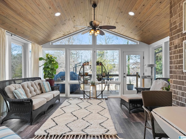 sunroom featuring vaulted ceiling, ceiling fan, and wooden ceiling