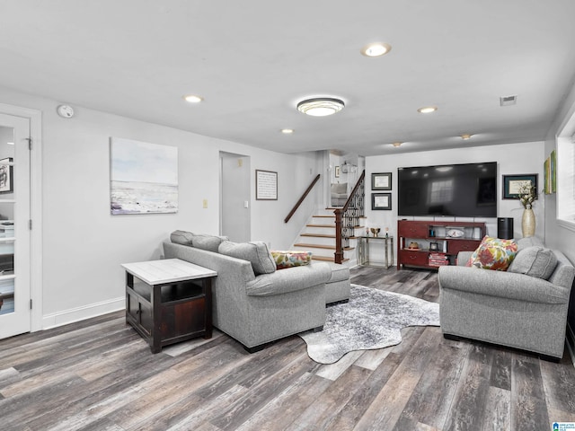 living room featuring dark wood-type flooring