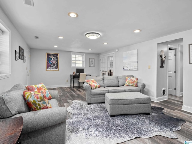 living room featuring french doors and dark hardwood / wood-style flooring